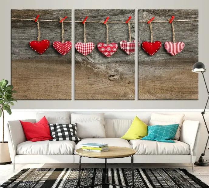 The "Love on the Wood Wall Art Canvas Print" enhances the modern living room with its hanging heart designs. The museum-quality canvases feature a UV-protective coating, ensuring their beauty lasts over time.