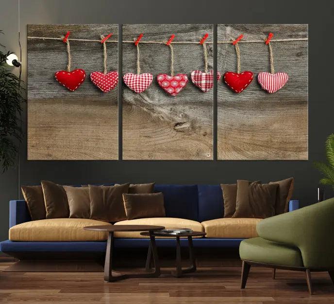 The "Love on the Wood Wall Art Canvas Print" enhances the modern living room with its hanging heart designs. The museum-quality canvases feature a UV-protective coating, ensuring their beauty lasts over time.