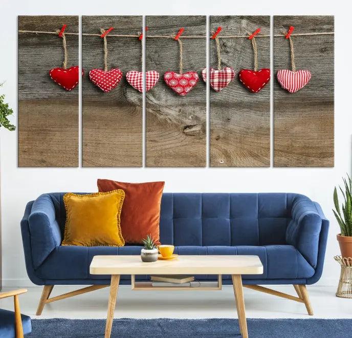 The "Love on the Wood Wall Art Canvas Print" enhances the modern living room with its hanging heart designs. The museum-quality canvases feature a UV-protective coating, ensuring their beauty lasts over time.