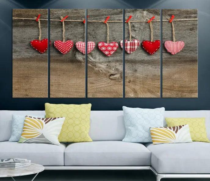 The "Love on the Wood Wall Art Canvas Print" enhances the modern living room with its hanging heart designs. The museum-quality canvases feature a UV-protective coating, ensuring their beauty lasts over time.