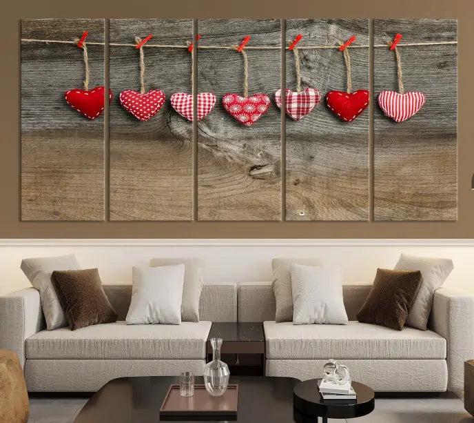 The "Love on the Wood Wall Art Canvas Print" enhances the modern living room with its hanging heart designs. The museum-quality canvases feature a UV-protective coating, ensuring their beauty lasts over time.