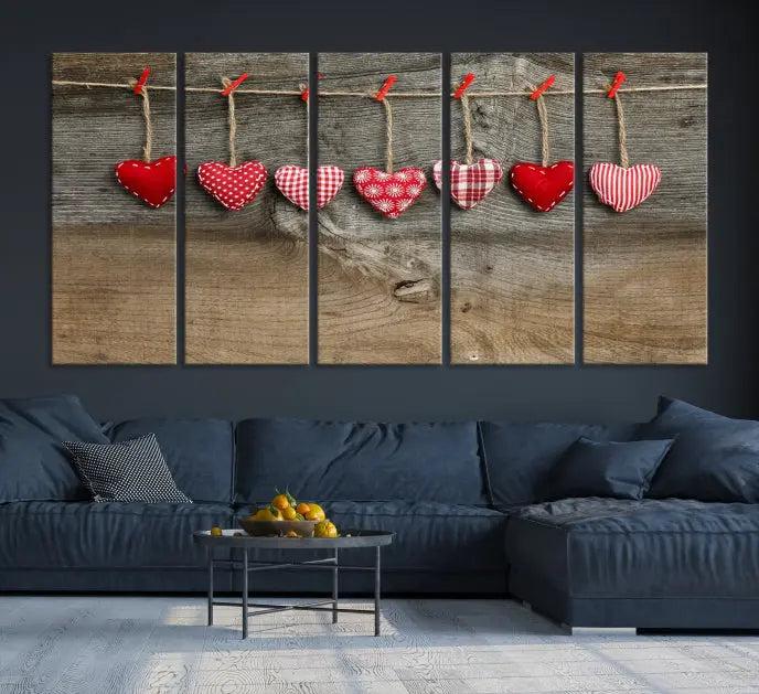 The "Love on the Wood Wall Art Canvas Print" enhances the modern living room with its hanging heart designs. The museum-quality canvases feature a UV-protective coating, ensuring their beauty lasts over time.