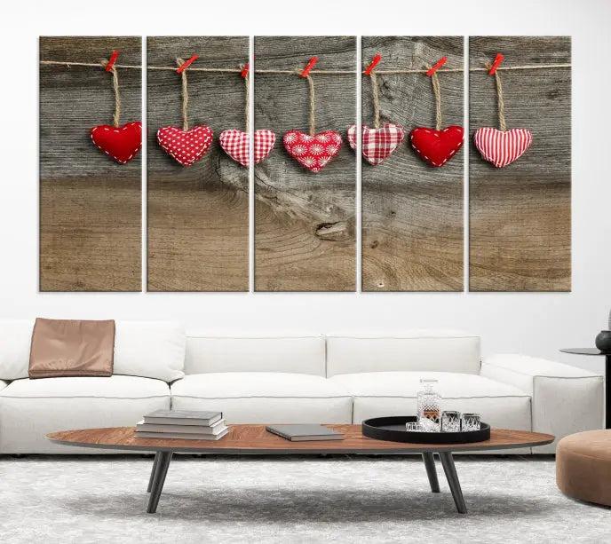 The "Love on the Wood Wall Art Canvas Print" enhances the modern living room with its hanging heart designs. The museum-quality canvases feature a UV-protective coating, ensuring their beauty lasts over time.