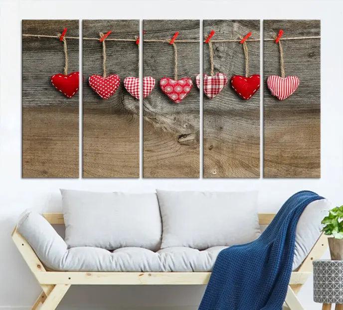 The "Love on the Wood Wall Art Canvas Print" enhances the modern living room with its hanging heart designs. The museum-quality canvases feature a UV-protective coating, ensuring their beauty lasts over time.