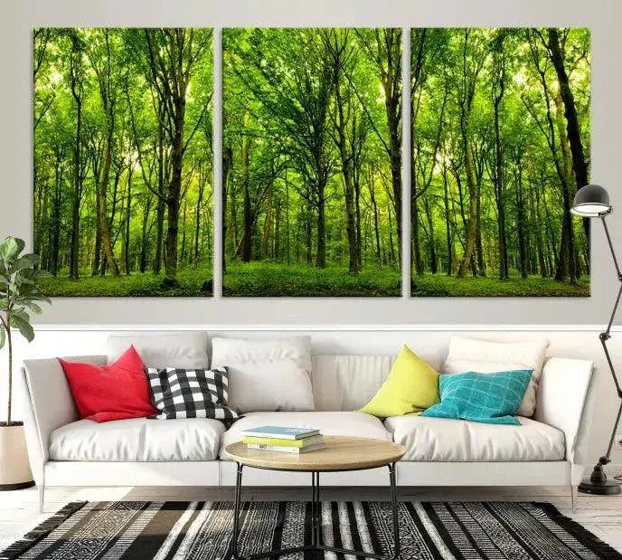 A modern living room features the Lush Green Forest Canvas Print—a 3-panel forest wall art—mounted above, creating an ideal retreat for nature lovers.