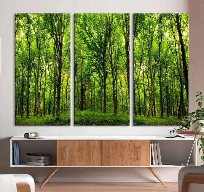 A modern living room features the Lush Green Forest Canvas Print—a 3-panel forest wall art—mounted above, creating an ideal retreat for nature lovers.