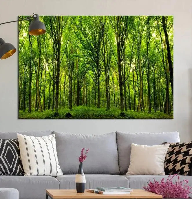 A modern living room features the Lush Green Forest Canvas Print—a 3-panel forest wall art—mounted above, creating an ideal retreat for nature lovers.