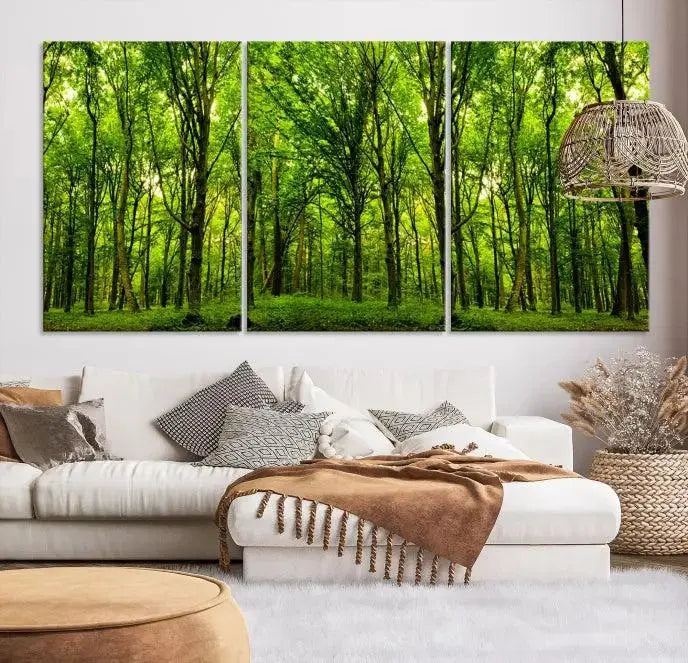 A modern living room features the Lush Green Forest Canvas Print—a 3-panel forest wall art—mounted above, creating an ideal retreat for nature lovers.