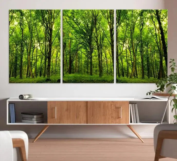 A modern living room features the Lush Green Forest Canvas Print—a 3-panel forest wall art—mounted above, creating an ideal retreat for nature lovers.