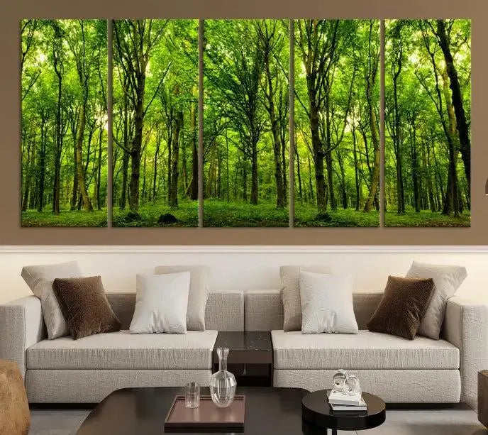 A modern living room features the Lush Green Forest Canvas Print—a 3-panel forest wall art—mounted above, creating an ideal retreat for nature lovers.