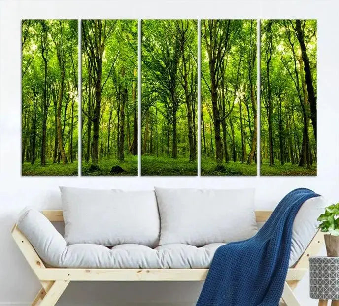 A modern living room features the Lush Green Forest Canvas Print—a 3-panel forest wall art—mounted above, creating an ideal retreat for nature lovers.