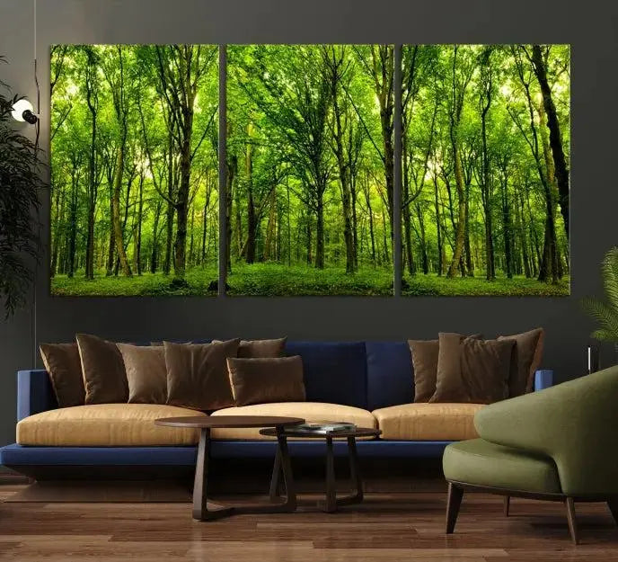 A modern living room features the Lush Green Forest Canvas Print—a 3-panel forest wall art—mounted above, creating an ideal retreat for nature lovers.