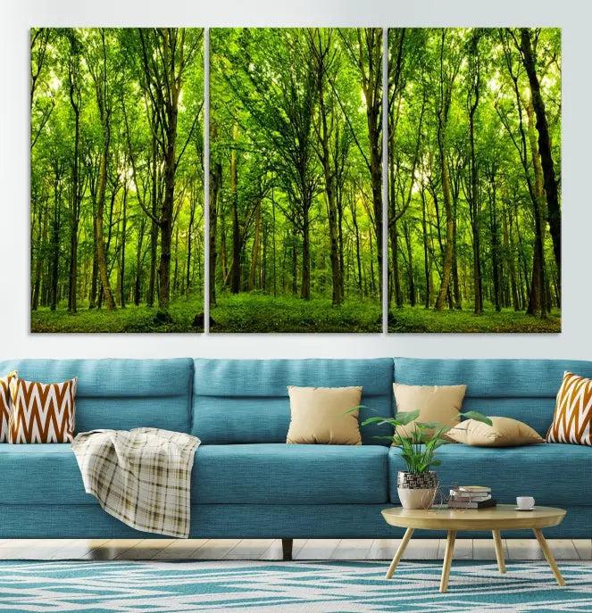 A modern living room features the Lush Green Forest Canvas Print—a 3-panel forest wall art—mounted above, creating an ideal retreat for nature lovers.