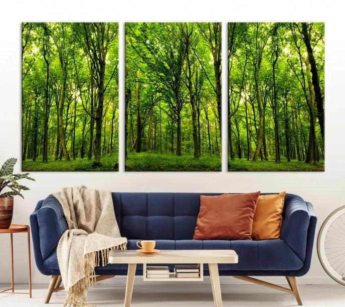 A modern living room features the Lush Green Forest Canvas Print—a 3-panel forest wall art—mounted above, creating an ideal retreat for nature lovers.