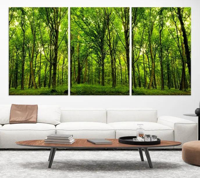 A modern living room features the Lush Green Forest Canvas Print—a 3-panel forest wall art—mounted above, creating an ideal retreat for nature lovers.