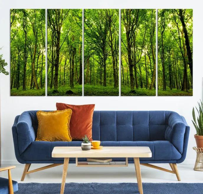 A modern living room features the Lush Green Forest Canvas Print—a 3-panel forest wall art—mounted above, creating an ideal retreat for nature lovers.