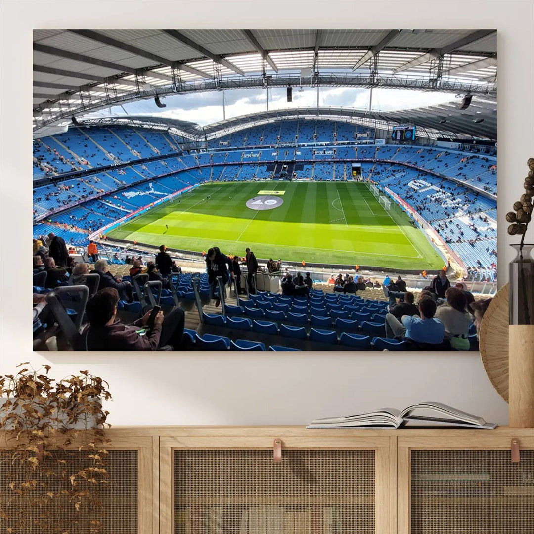 A captivating Manchester City Etihad Stadium Wall Art Canvas Print graces the living room, showcasing a football stadium with an empty field in a gallery-quality finish.