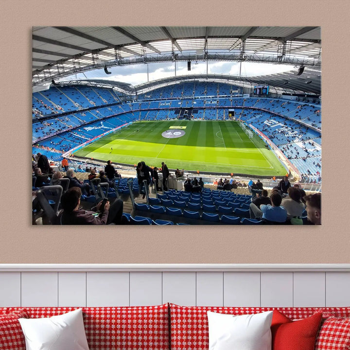 A captivating Manchester City Etihad Stadium Wall Art Canvas Print graces the living room, showcasing a football stadium with an empty field in a gallery-quality finish.