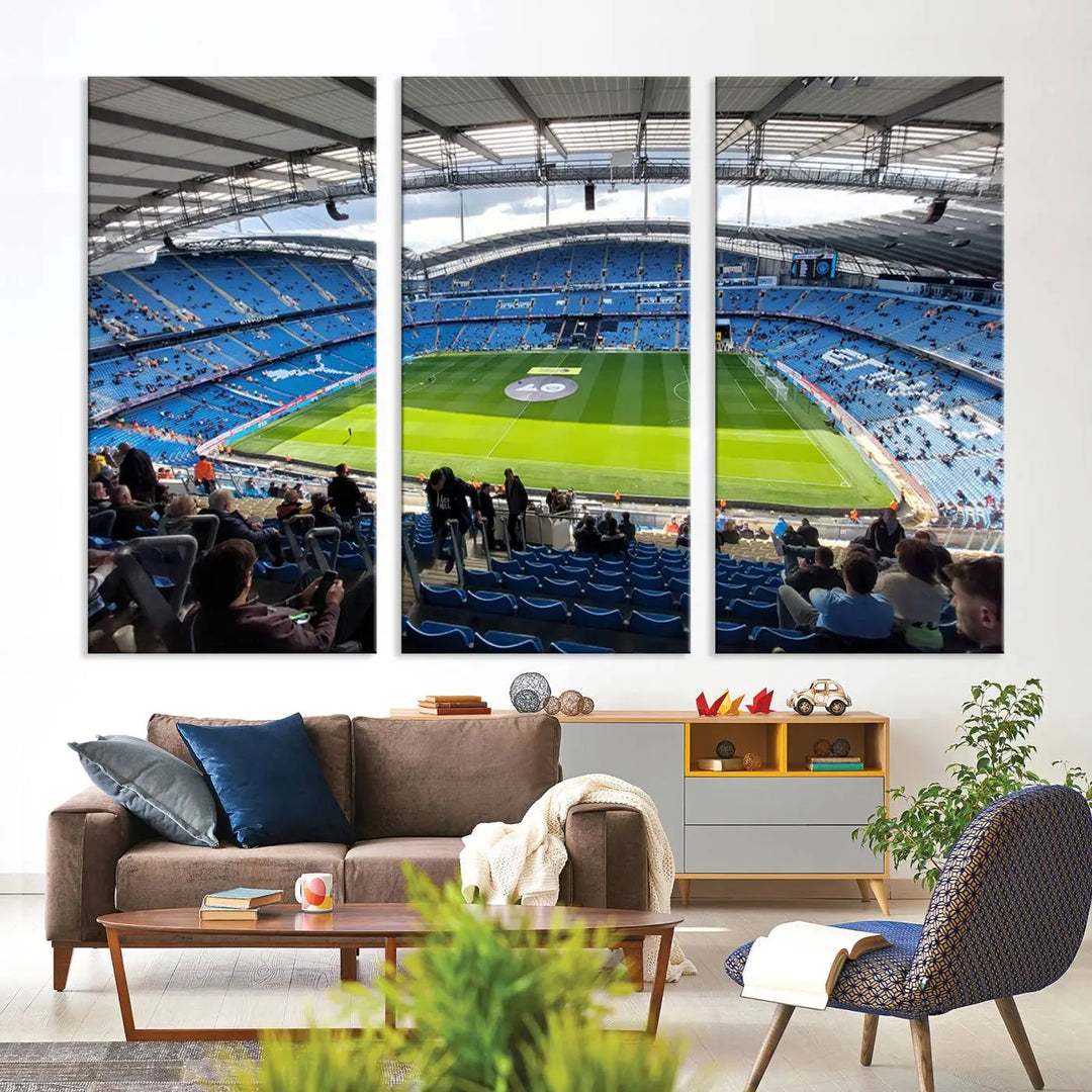 A captivating Manchester City Etihad Stadium Wall Art Canvas Print graces the living room, showcasing a football stadium with an empty field in a gallery-quality finish.