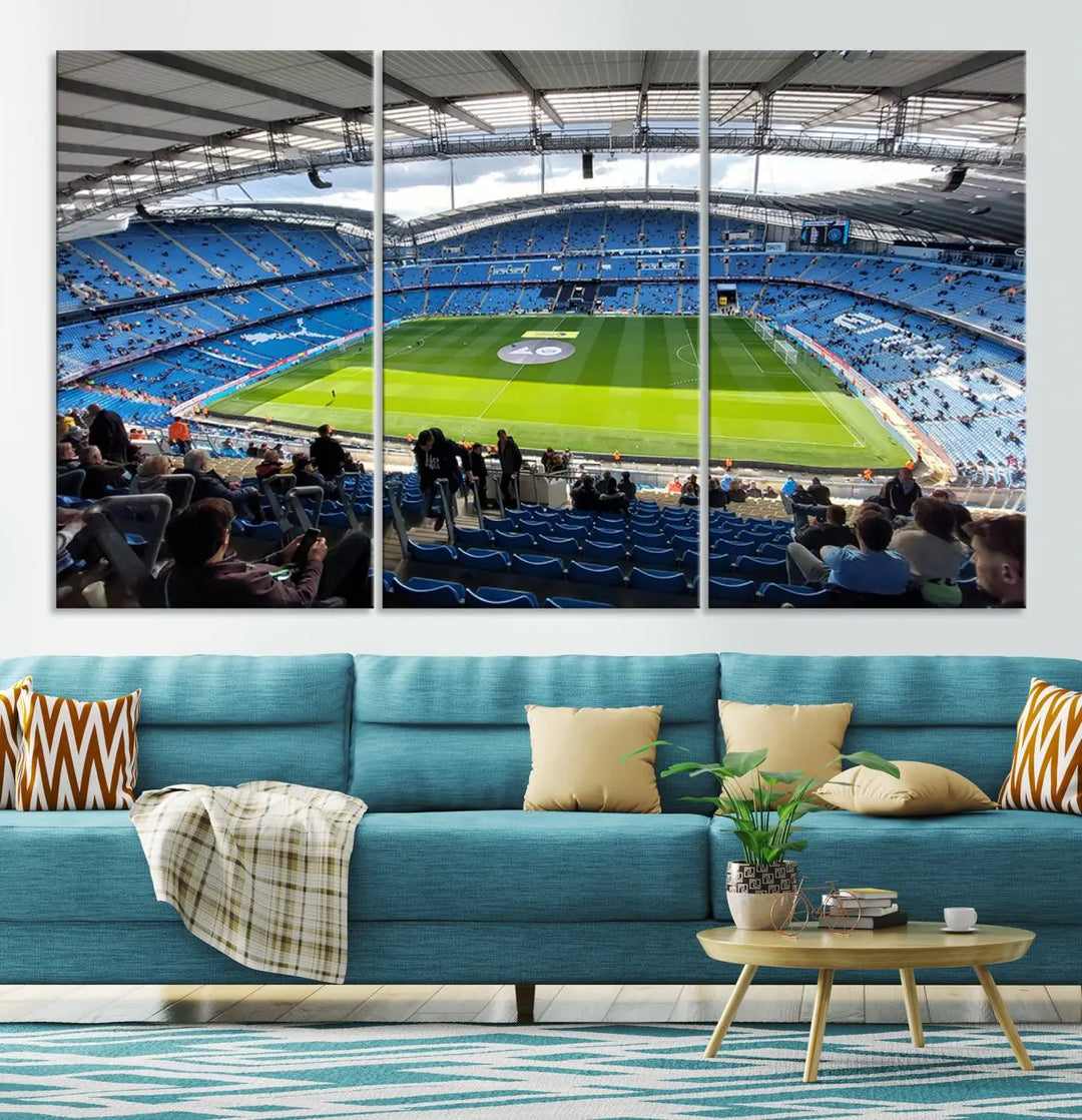 A captivating Manchester City Etihad Stadium Wall Art Canvas Print graces the living room, showcasing a football stadium with an empty field in a gallery-quality finish.