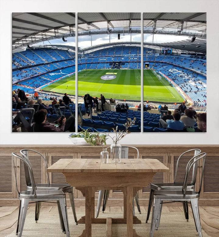 A captivating Manchester City Etihad Stadium Wall Art Canvas Print graces the living room, showcasing a football stadium with an empty field in a gallery-quality finish.