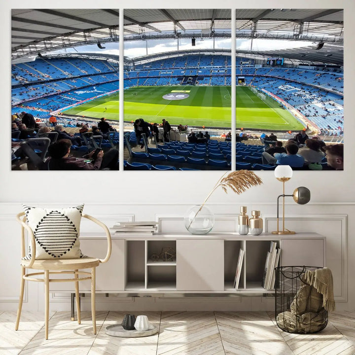 A captivating Manchester City Etihad Stadium Wall Art Canvas Print graces the living room, showcasing a football stadium with an empty field in a gallery-quality finish.