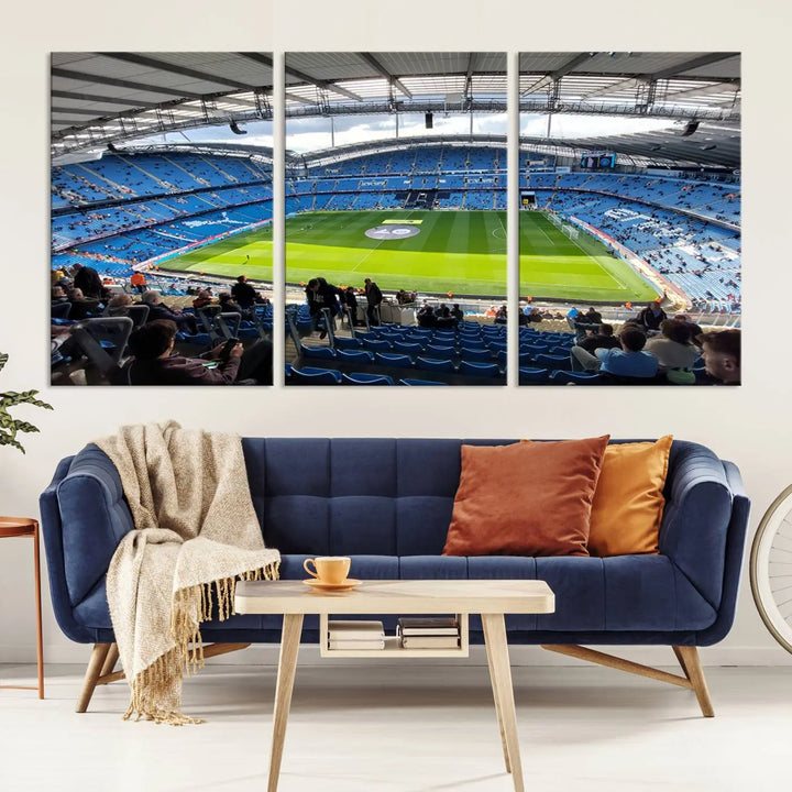 A captivating Manchester City Etihad Stadium Wall Art Canvas Print graces the living room, showcasing a football stadium with an empty field in a gallery-quality finish.