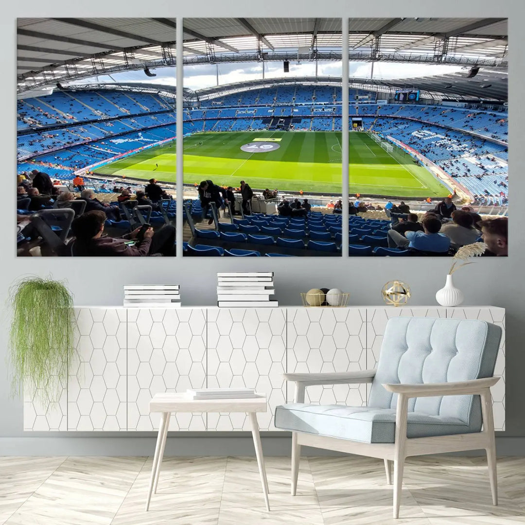 A captivating Manchester City Etihad Stadium Wall Art Canvas Print graces the living room, showcasing a football stadium with an empty field in a gallery-quality finish.