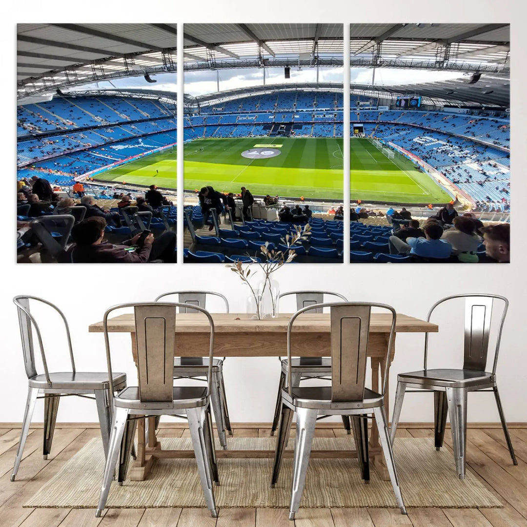 A captivating Manchester City Etihad Stadium Wall Art Canvas Print graces the living room, showcasing a football stadium with an empty field in a gallery-quality finish.