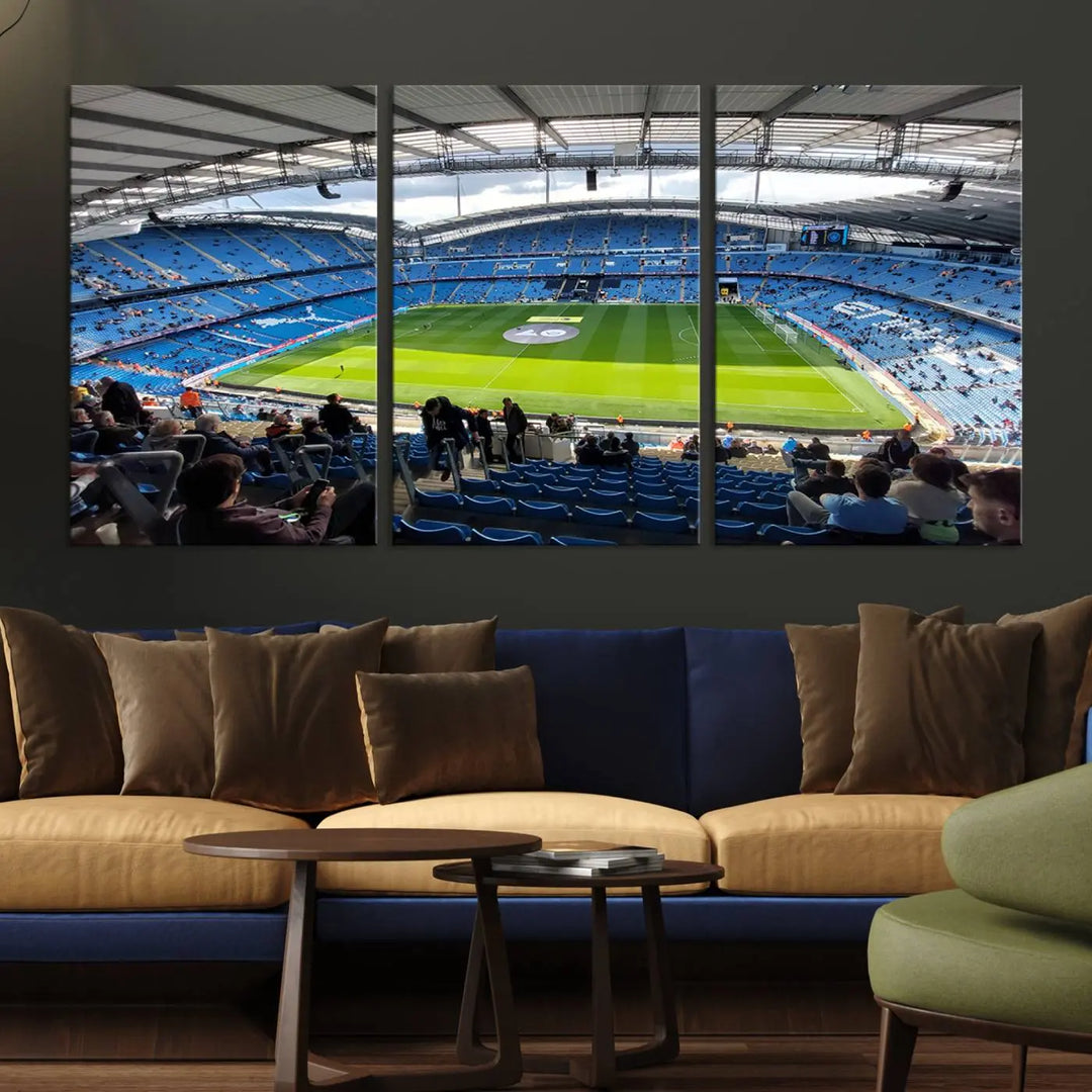 A captivating Manchester City Etihad Stadium Wall Art Canvas Print graces the living room, showcasing a football stadium with an empty field in a gallery-quality finish.