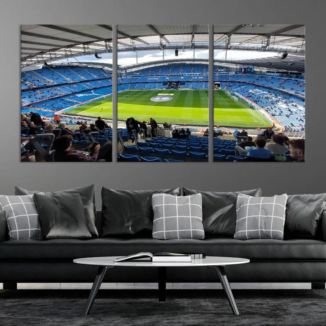 A captivating Manchester City Etihad Stadium Wall Art Canvas Print graces the living room, showcasing a football stadium with an empty field in a gallery-quality finish.