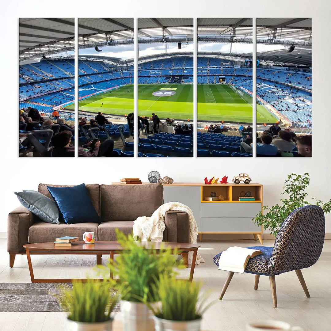 A captivating Manchester City Etihad Stadium Wall Art Canvas Print graces the living room, showcasing a football stadium with an empty field in a gallery-quality finish.