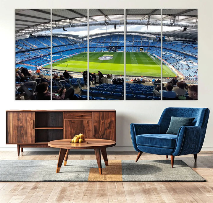 A captivating Manchester City Etihad Stadium Wall Art Canvas Print graces the living room, showcasing a football stadium with an empty field in a gallery-quality finish.