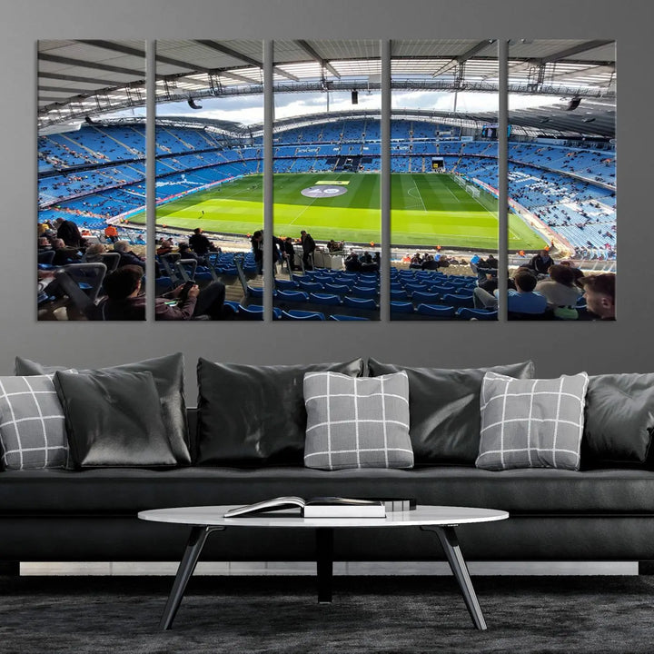 A captivating Manchester City Etihad Stadium Wall Art Canvas Print graces the living room, showcasing a football stadium with an empty field in a gallery-quality finish.