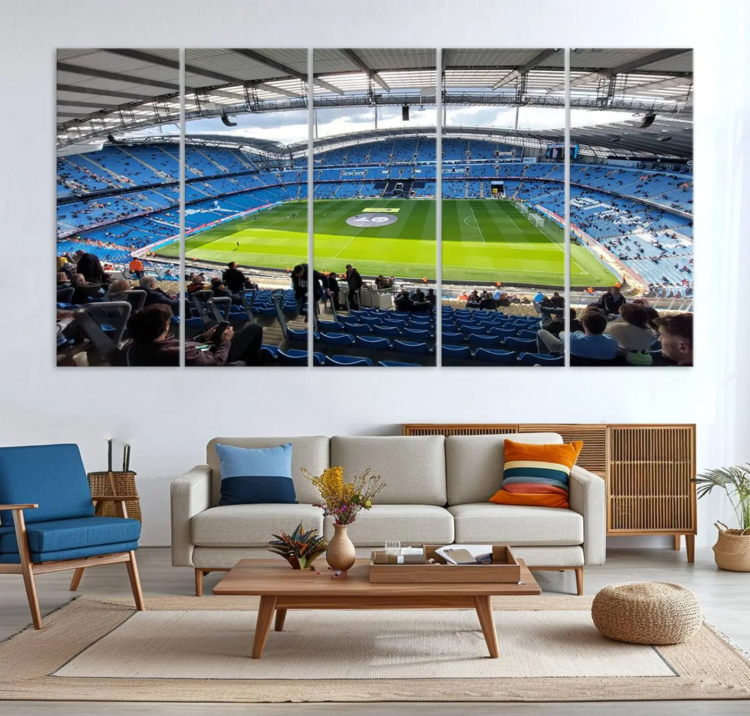 A captivating Manchester City Etihad Stadium Wall Art Canvas Print graces the living room, showcasing a football stadium with an empty field in a gallery-quality finish.