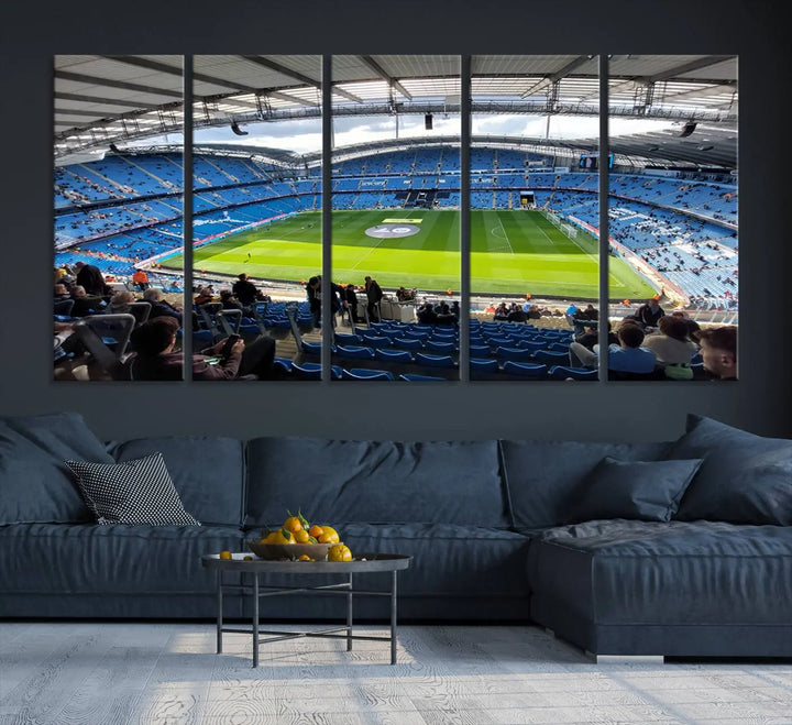 A captivating Manchester City Etihad Stadium Wall Art Canvas Print graces the living room, showcasing a football stadium with an empty field in a gallery-quality finish.