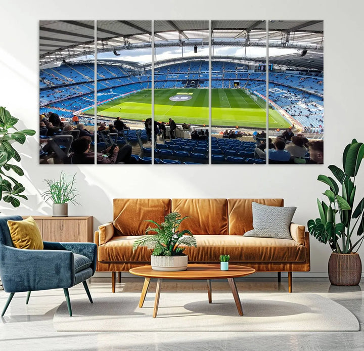 A captivating Manchester City Etihad Stadium Wall Art Canvas Print graces the living room, showcasing a football stadium with an empty field in a gallery-quality finish.