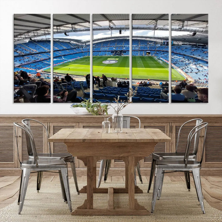 A captivating Manchester City Etihad Stadium Wall Art Canvas Print graces the living room, showcasing a football stadium with an empty field in a gallery-quality finish.