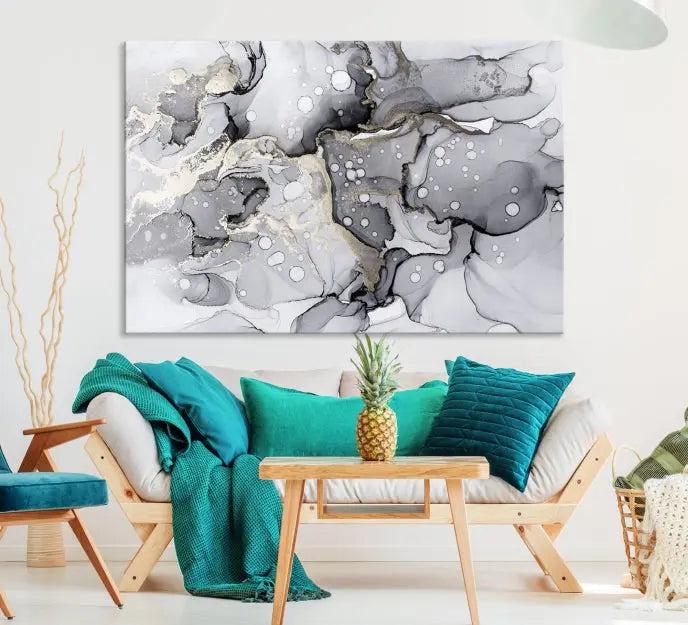 The "Marble Fluid Effect Wall Art Abstract Canvas Wall Art Print" forms a stunning abstract triptych with black, gray, and gold patterns in a modern living room. These museum-quality pieces include a UV-protective coating to ensure lasting beauty.