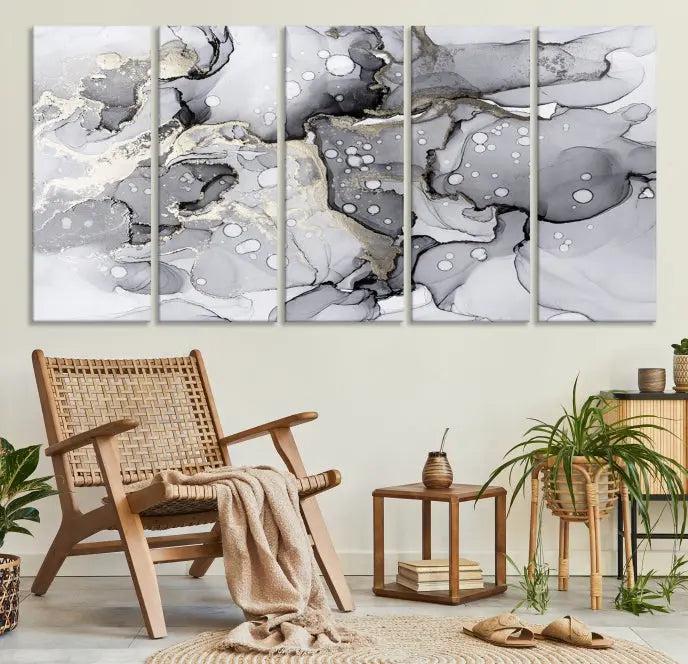 The "Marble Fluid Effect Wall Art Abstract Canvas Wall Art Print" forms a stunning abstract triptych with black, gray, and gold patterns in a modern living room. These museum-quality pieces include a UV-protective coating to ensure lasting beauty.