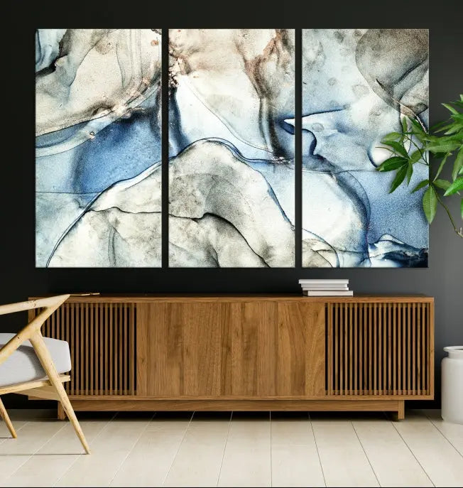 Introducing the Marble Fluid Effect Wall Art Abstract Canvas Wall Art Print, featuring a stunning triptych design with blue and beige swirls on museum-quality canvas.