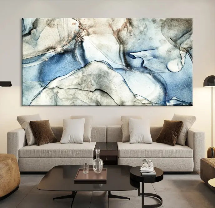 Introducing the Marble Fluid Effect Wall Art Abstract Canvas Wall Art Print, featuring a stunning triptych design with blue and beige swirls on museum-quality canvas.