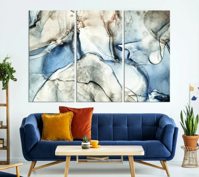 Introducing the Marble Fluid Effect Wall Art Abstract Canvas Wall Art Print, featuring a stunning triptych design with blue and beige swirls on museum-quality canvas.