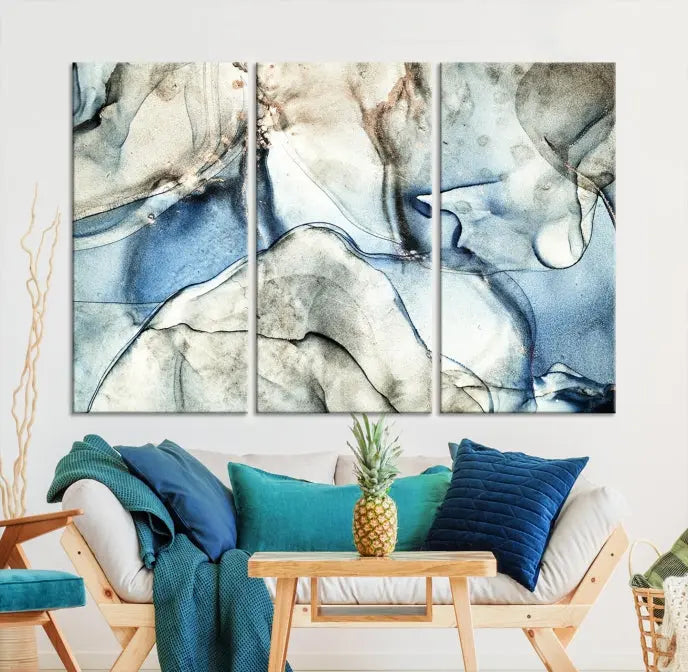 Introducing the Marble Fluid Effect Wall Art Abstract Canvas Wall Art Print, featuring a stunning triptych design with blue and beige swirls on museum-quality canvas.