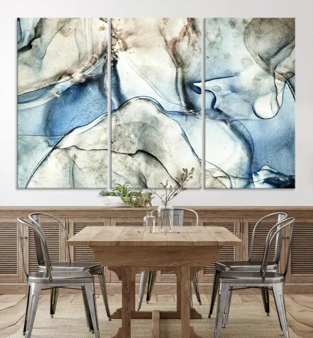 Introducing the Marble Fluid Effect Wall Art Abstract Canvas Wall Art Print, featuring a stunning triptych design with blue and beige swirls on museum-quality canvas.