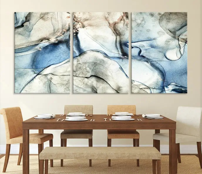 Introducing the Marble Fluid Effect Wall Art Abstract Canvas Wall Art Print, featuring a stunning triptych design with blue and beige swirls on museum-quality canvas.