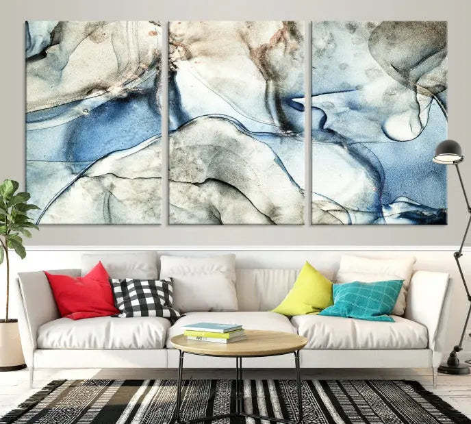 Introducing the Marble Fluid Effect Wall Art Abstract Canvas Wall Art Print, featuring a stunning triptych design with blue and beige swirls on museum-quality canvas.