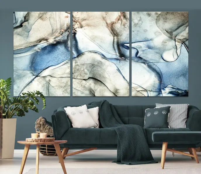 Introducing the Marble Fluid Effect Wall Art Abstract Canvas Wall Art Print, featuring a stunning triptych design with blue and beige swirls on museum-quality canvas.