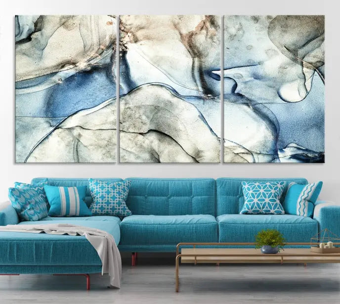 Introducing the Marble Fluid Effect Wall Art Abstract Canvas Wall Art Print, featuring a stunning triptych design with blue and beige swirls on museum-quality canvas.