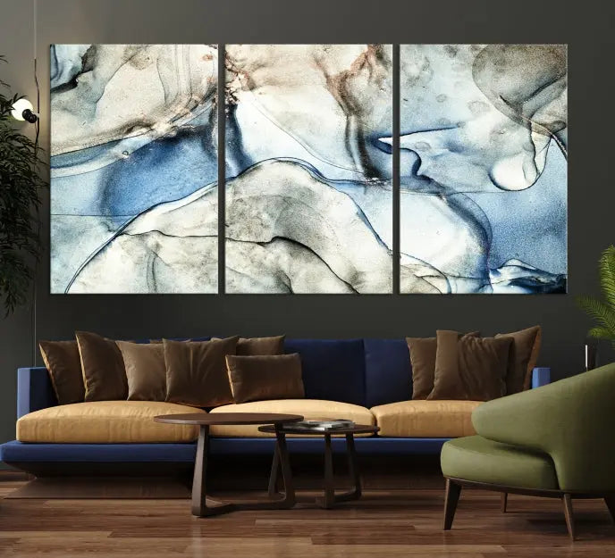 Introducing the Marble Fluid Effect Wall Art Abstract Canvas Wall Art Print, featuring a stunning triptych design with blue and beige swirls on museum-quality canvas.